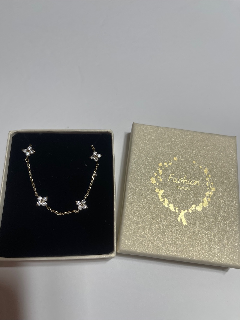 Gold tone with four Sparkling Floral Stations Bracelet -